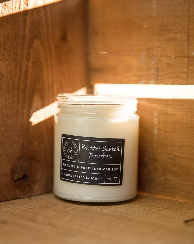 Butterscotch Bourbon scented soy candle in the sunlight